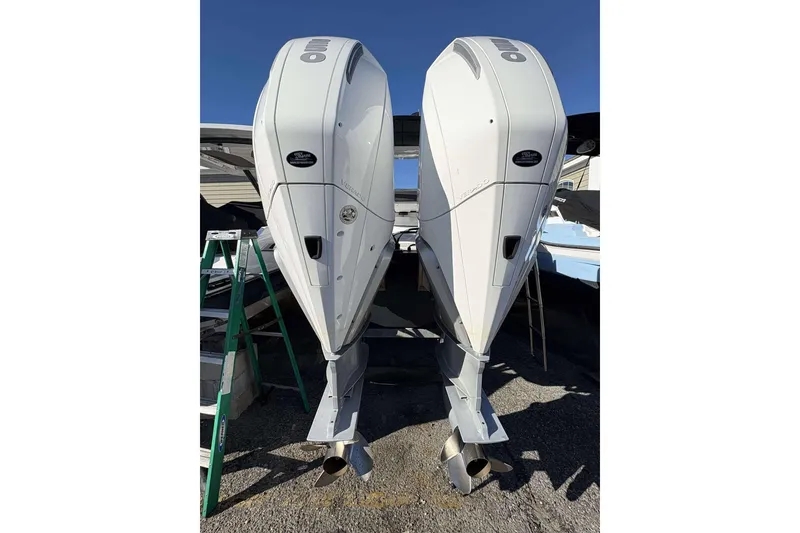 Slide: The Image of Twin outboard engines on a 2020 Monterey 305SS Super Sport boat. - 31