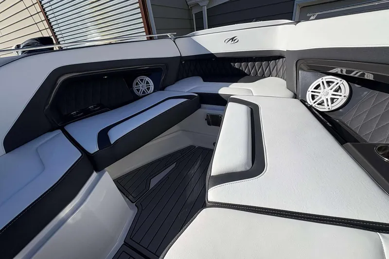 Slide: The Image of Luxurious interior of 2020 Monterey 305SS Super Sport boat with sleek seating and speakers. - 5