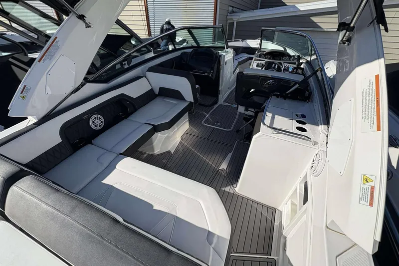 Slide: The Image of 2020 Monterey 305SS Super Sport boat interior with sleek seating and modern dashboard. - 8