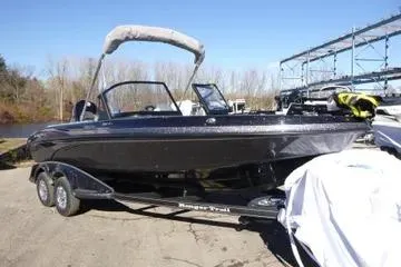 Slide: The Image of 2026 Ranger 2080MS boat on trailer, parked outdoors under clear blue sky. - 73