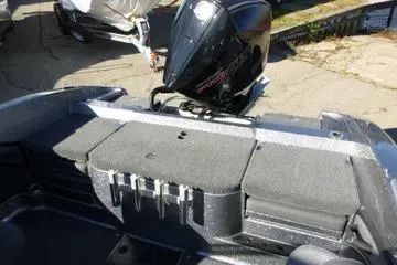 Slide: The Image of 2026 Ranger 2080MS boat with motor, featuring spacious seating and storage. - 78