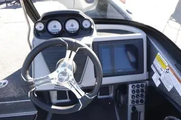 Slide: The Image of 2026 Ranger 2080MS boat dashboard with steering wheel, gauges, and touchscreen display. - 81