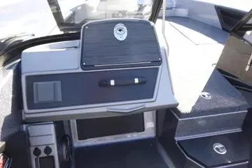 Slide: The Image of 2026 Ranger 2080MS boat interior with modern dashboard and storage compartments. - 86