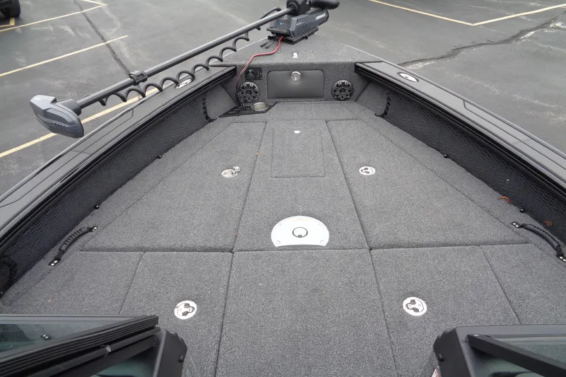 Slide: The Image of 2026 Lund 2175 Pro-V boat deck with carpeted surface and storage compartments. - 12