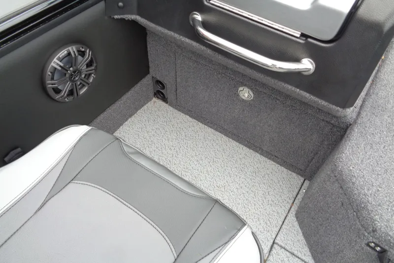 Slide: The Image of Interior of 2026 Lund 2175 Pro-V boat with speaker and storage compartment. - 17