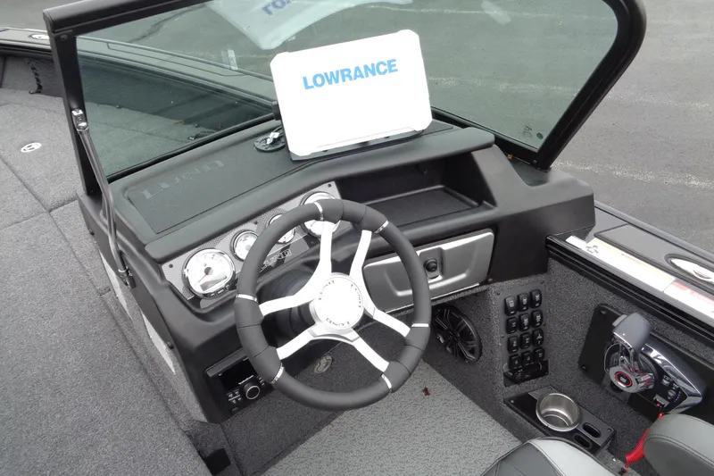 Slide: The Image of 2026 Lund 2175 Pro-V boat dashboard with steering wheel and Lowrance display. - 20