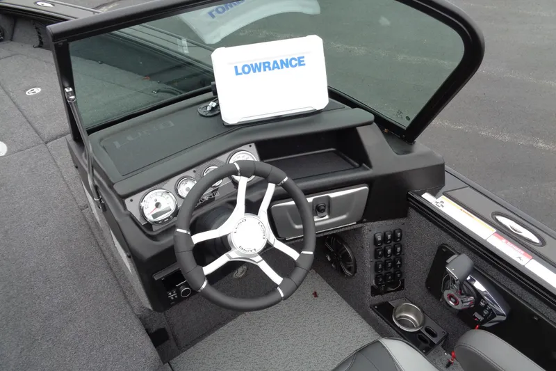 Slide: The Image of 2026 Lund 2175 Pro-V boat dashboard with Lowrance display and modern controls. - 23