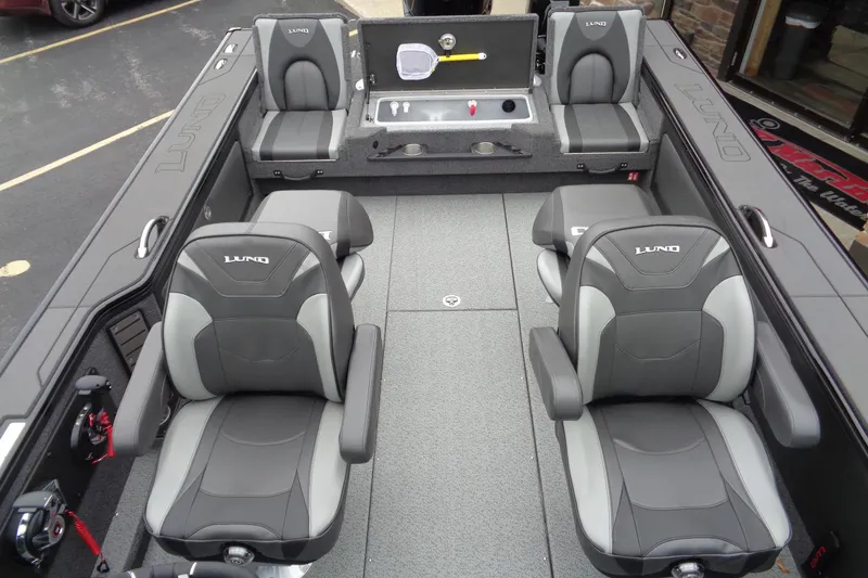 Slide: The Image of 2026 Lund 2175 Pro-V boat interior with gray seating and spacious layout. - 28