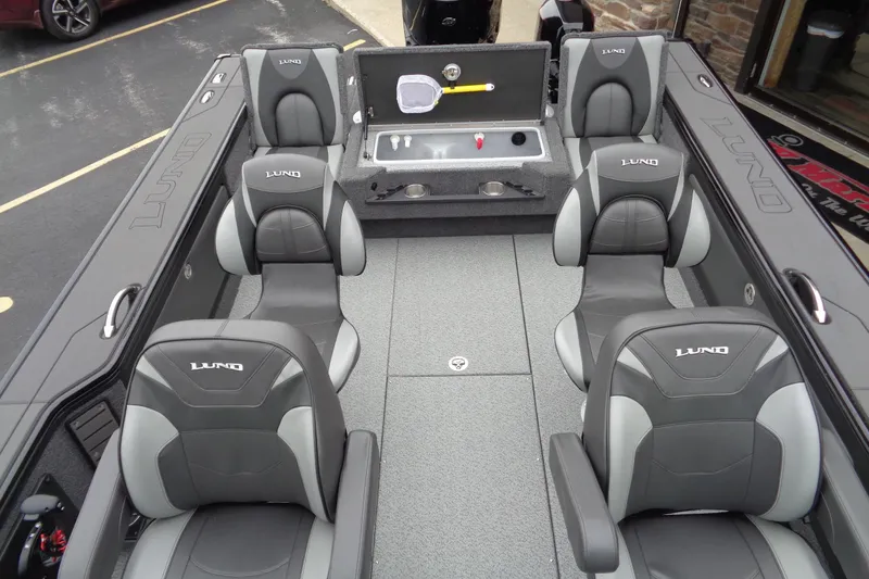 Slide: The Image of 2026 Lund 2175 Pro-V boat interior with six seats and storage compartment. - 29