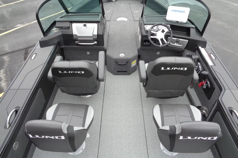 Slide: The Image of 2026 Lund 2175 Pro-V boat interior with four seats and modern dashboard. - 33