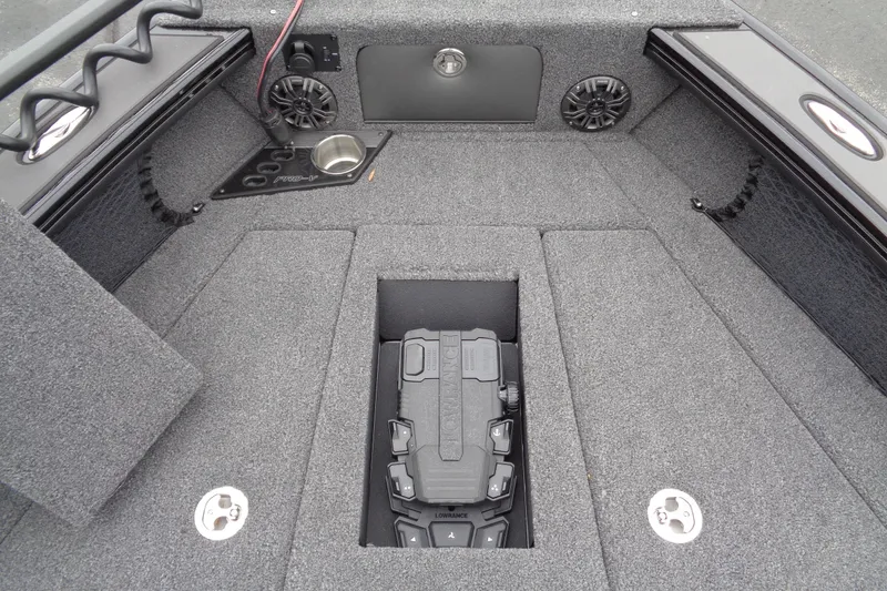 Slide: The Image of 2026 Lund 2175 Pro-V boat interior with storage compartments and speakers. - 35