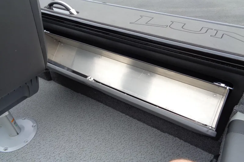 Slide: The Image of 2026 Lund 2175 Pro-V boat interior storage compartment, featuring sleek design and durable materials. - 38