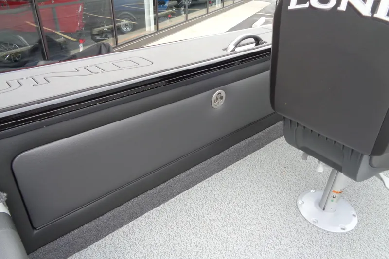 Slide: The Image of Interior of 2026 Lund 2175 Pro-V boat with seating and storage compartment. - 39