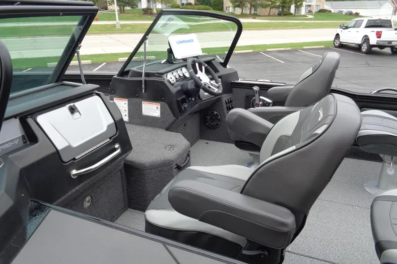 Slide: The Image of 2026 Lund 2175 Pro-V boat interior with modern seating and control panel. - 45