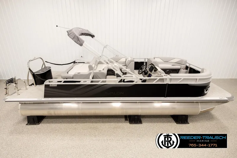 The Image of 2026 Avalon VEN85 VRB pontoon boat in showroom, featuring sleek design and modern amenities. - 1