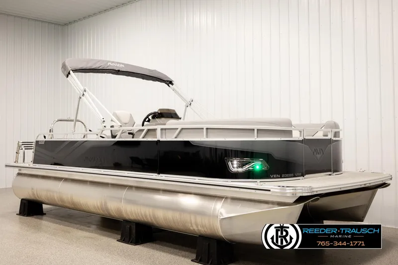 Slide: The Image of 2026 Avalon VEN85 VRB pontoon boat in showroom, featuring sleek design and modern amenities. - 2