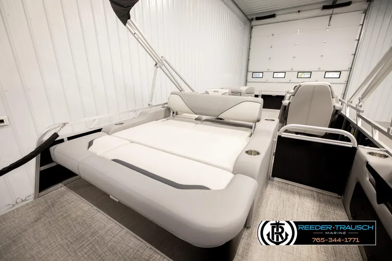 Slide: The Image of 2026 Avalon VEN85 VRB boat interior with luxurious seating in a spacious garage. - 26