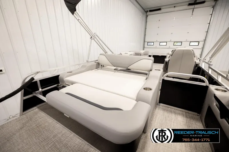 Slide: The Image of 2026 Avalon VEN85 VRB boat interior with luxurious seating in a spacious garage. - 27