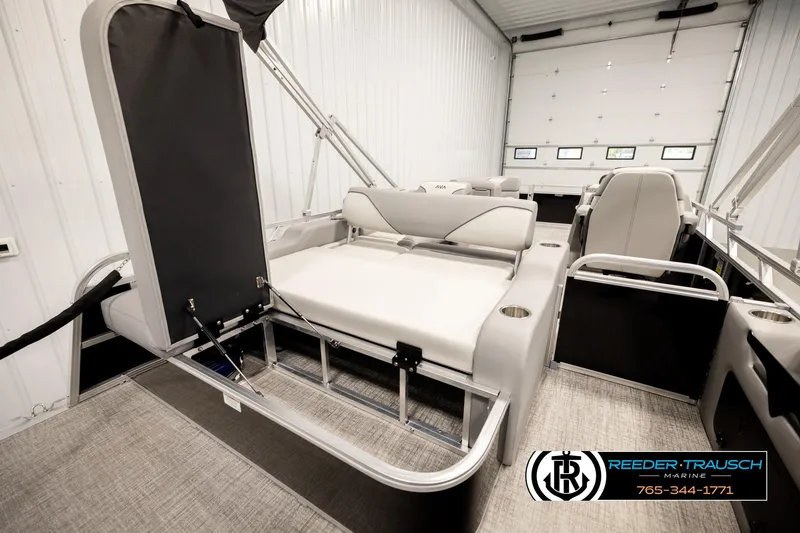 Slide: The Image of 2026 Avalon VEN85 VRB boat interior with seating and storage, showcased in a marine showroom. - 28