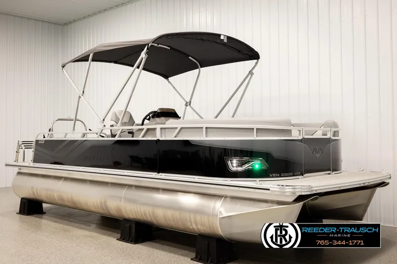 Slide: The Image of 2026 Avalon VEN85 VRB pontoon boat with canopy in showroom setting. - 3