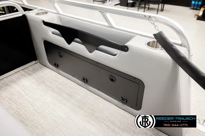 Slide: The Image of 2026 Avalon VEN85 VRB boat interior with storage compartment and cup holders. - 31