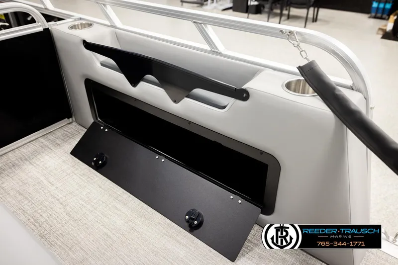 Slide: The Image of 2026 Avalon VEN85 VRB boat interior with storage compartment and cup holder. - 32