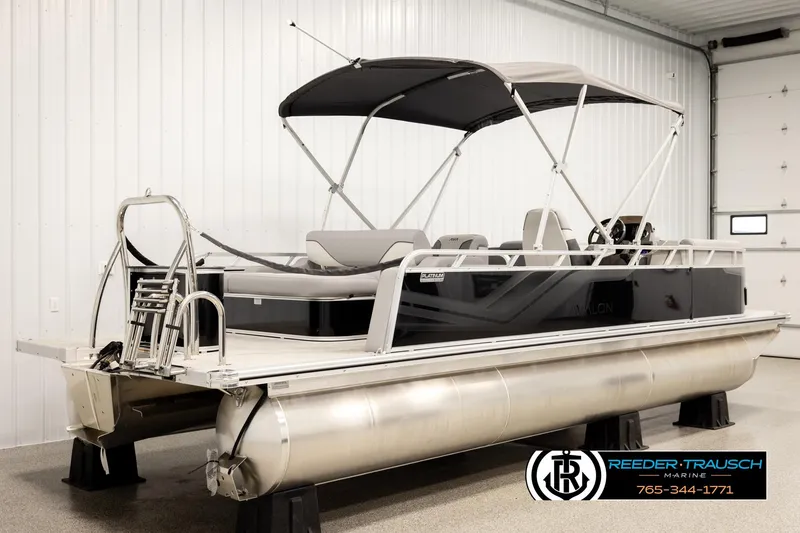 Slide: The Image of 2026 Avalon VEN85 VRB pontoon boat in showroom, featuring sleek design and canopy. - 6