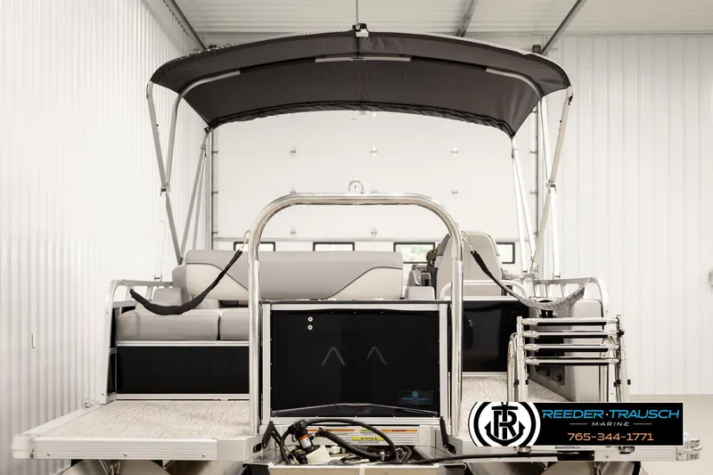 Slide: The Image of 2026 Avalon VEN85 VRB pontoon boat in a showroom with canopy and seating. - 7