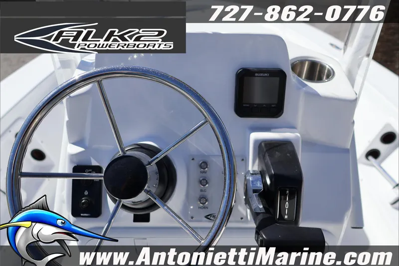 Slide: The Image of Steering console of 2026 ALK2 Powerboats 17HS with controls and display. - 11