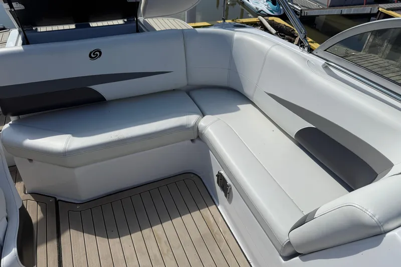 Slide: The Image of 2022 Hurricane SunDeck 187 IO boat interior with white cushioned seating. - 10