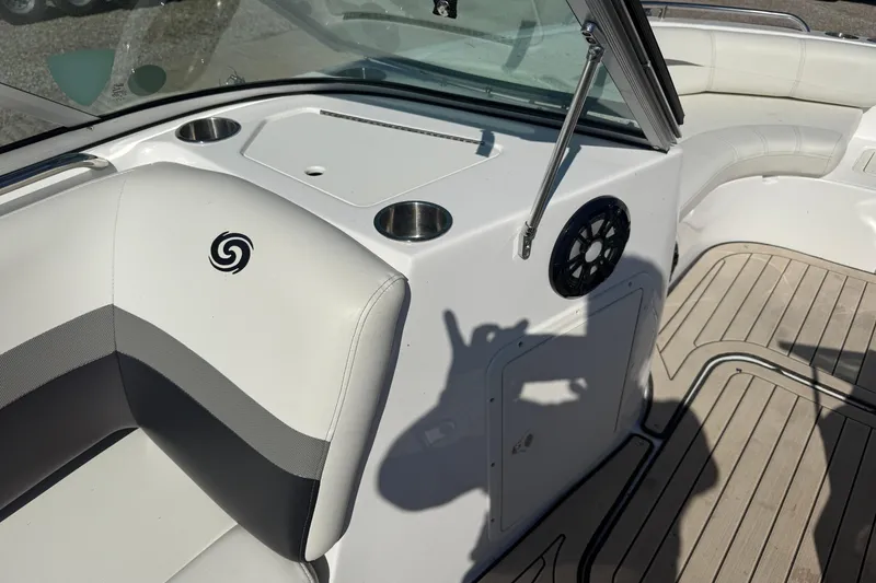 Slide: The Image of 2022 Hurricane SunDeck 187 IO boat interior with seating and cup holders. - 13