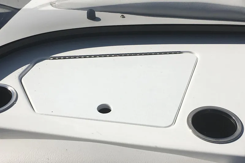 Slide: The Image of Manufacturer Provided Image: 2022 Hurricane SunDeck 187 IO dashboard with cup holders and storage compartment. - 2