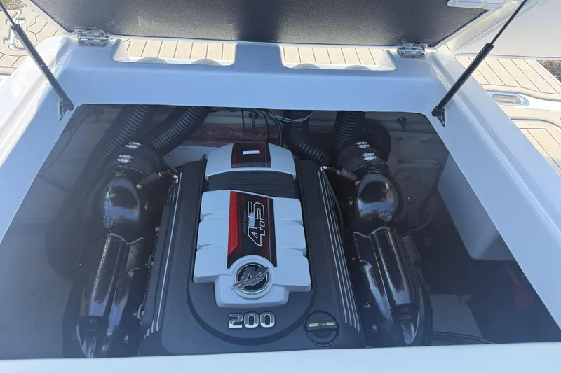 Slide: The Image of Engine compartment of 2022 Hurricane SunDeck 187 IO boat, featuring a powerful 4.5L engine. - 8