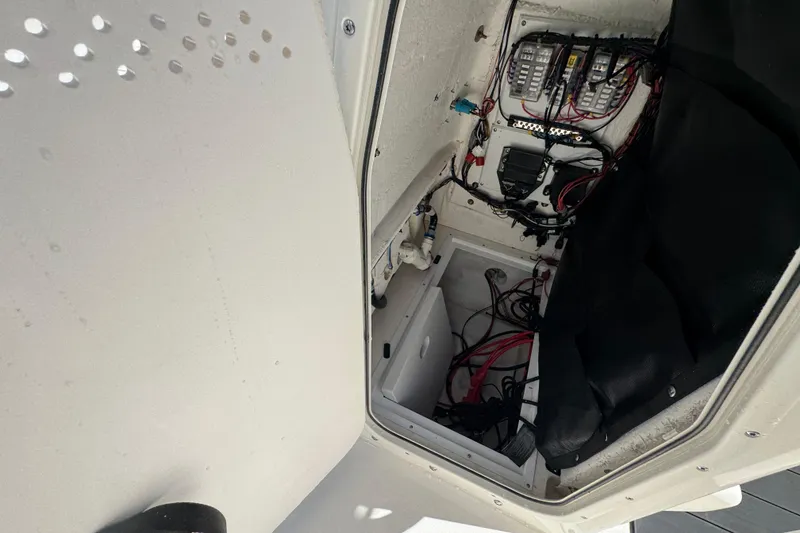Slide: The Image of Interior view of 2026 Skeeter SX2350 boat's wiring and storage compartment. - 18