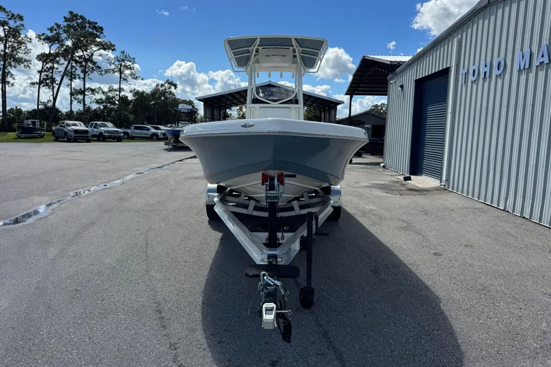 Slide: The Image of 2026 Skeeter SX2350 boat on trailer at marina under blue sky. - 3