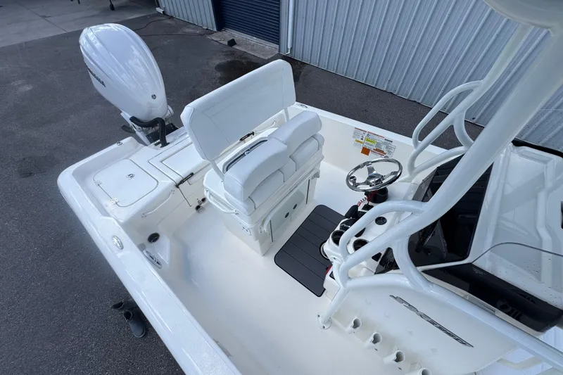Slide: The Image of 2026 Skeeter SX2350 boat interior with steering wheel and seating, viewed from above. - 9
