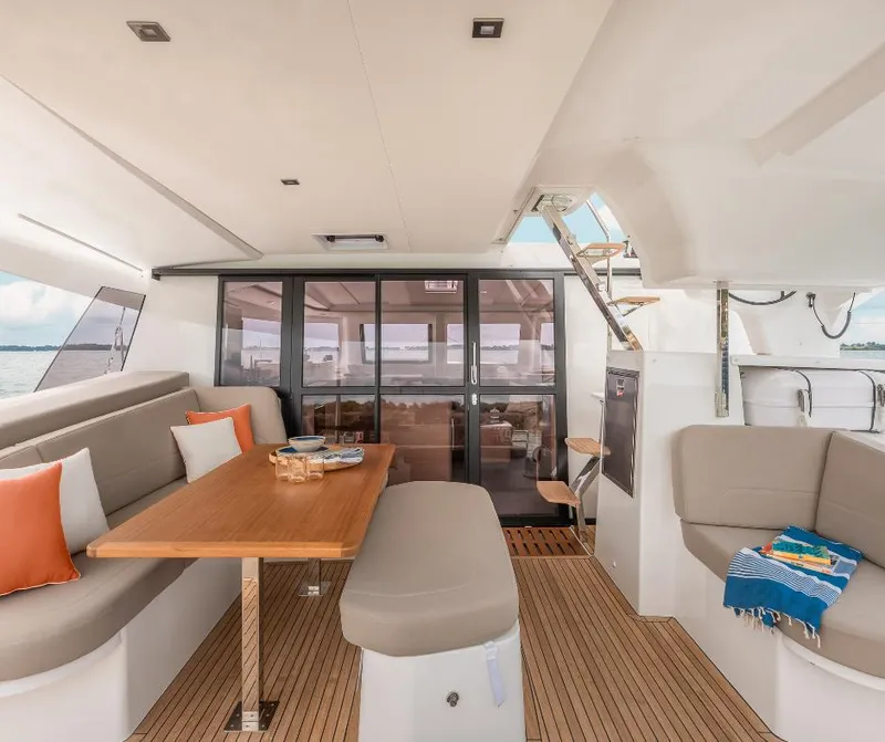 Slide: The Image of Luxurious interior of 2025 Fountaine Pajot NEW 41 catamaran with elegant seating and dining area. - 10