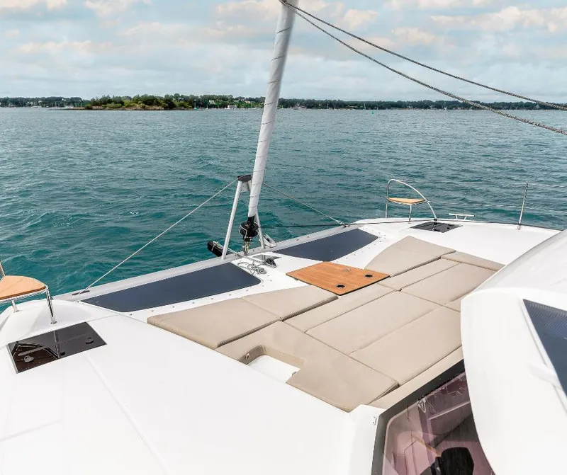 Slide: The Image of Luxurious deck of 2025 Fountaine Pajot NEW 41 catamaran on serene waters. - 11