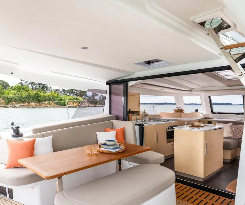 Slide: The Image of Luxurious interior of 2025 Fountaine Pajot NEW 41 catamaran with modern kitchen and dining area. - 9