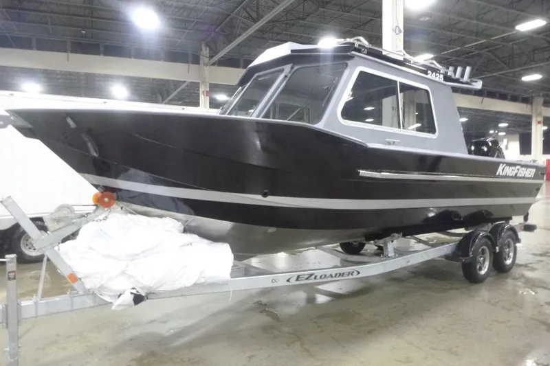 Slide: The Image of Steering console of 2026 KingFisher 2425 Escape HT boat, featuring modern controls and dashboard. - 10