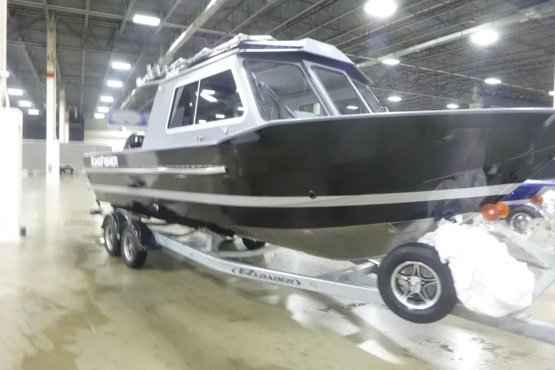 Slide: The Image of Interior of 2026 KingFisher 2425 Escape HT boat, featuring a sleek, modern seat design. - 11