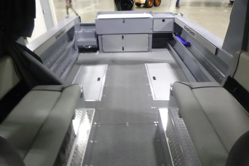 Slide: The Image of Storage compartment of 2026 KingFisher 2425 Escape HT boat, featuring a metallic interior. - 14