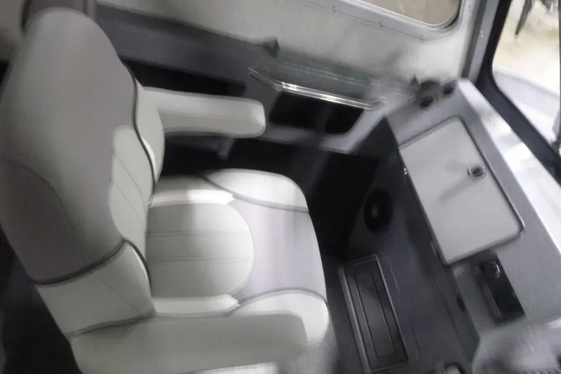 Slide: The Image of Interior view of 2026 KingFisher 2425 Escape HT boat, showcasing metal construction. - 19