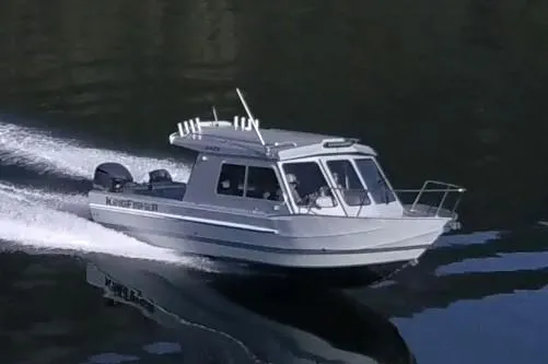 Slide: The Image of 2026 KingFisher 2425 Escape HT boat on trailer in indoor showroom. - 2