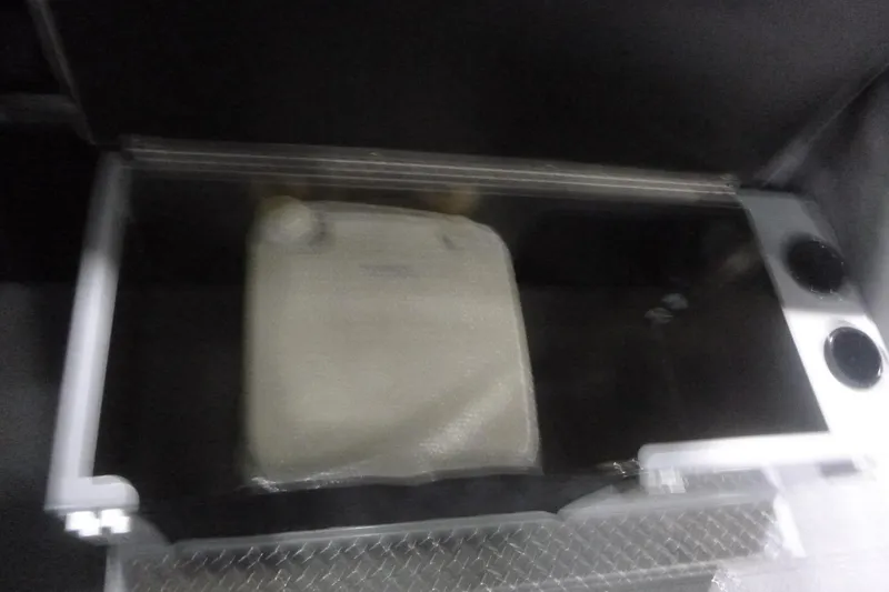 Slide: The Image of Interior view of 2026 KingFisher 2425 Escape HT boat with cup holders and storage compartments. - 24