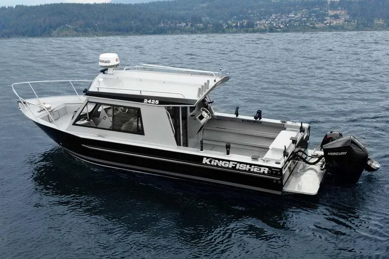 Slide: The Image of 2026 KingFisher 2425 Escape HT boat on trailer in indoor showroom. - 3