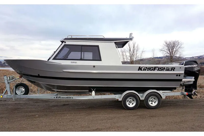 Slide: The Image of 2026 KingFisher 2425 Escape HT boat on trailer in indoor showroom. - 4