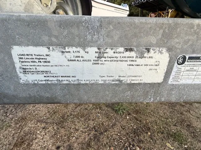 Slide: The Image of Label on Load Rite trailer, detailing specifications and manufacturing date, with visible tire information. - 14