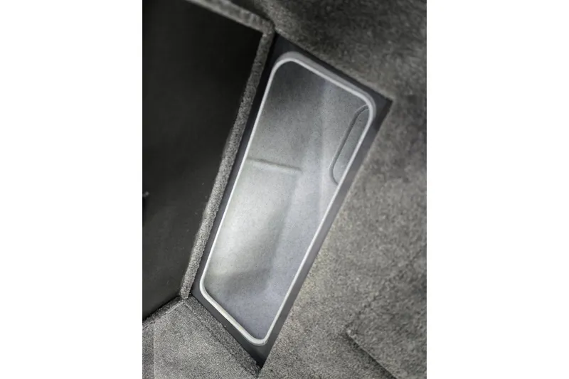 Slide: The Image of 2026 Princecraft Sport 185 boat storage compartment with carpeted interior. - 11
