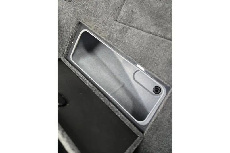 Slide: The Image of 2026 Princecraft Sport 185 boat storage compartment with gray interior. - 12